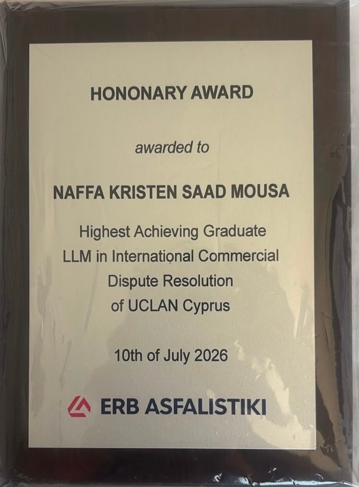 Honorary Award plaque awarded to NAFFA KRISTEN SAAD MOUSA for Highest Achieving Graduate, LLM in International Commercial Dispute Resolution, UCLAN Cyprus, July 10, 2026; ERB ASFALISTIKI logo at bottom.