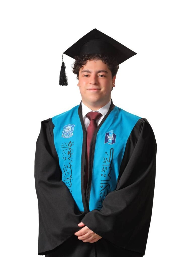 WhatsApp Image 2026-07-16 at 113730 AM2 - عروبة الاخباري | Oroba News Graduate in a black gown and blue stole with a mortarboard, posing against a white background.