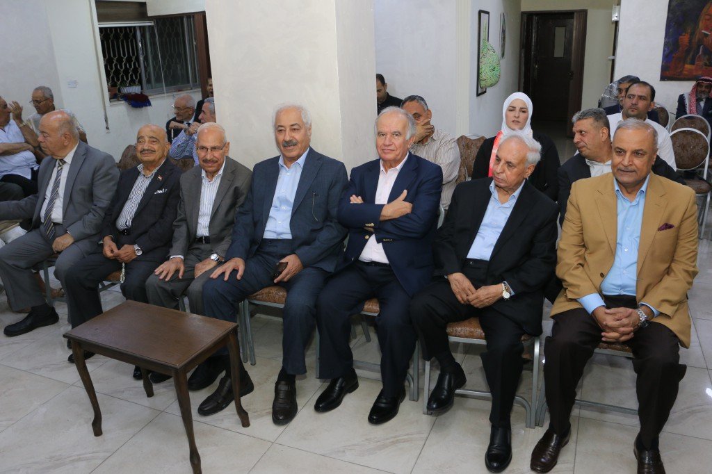 WhatsApp Image 2026-08-31 at 122502 AM - عروبة الاخباري | Oroba News Group of older men in suits seated in a row at an indoor gathering, posing for a photo.